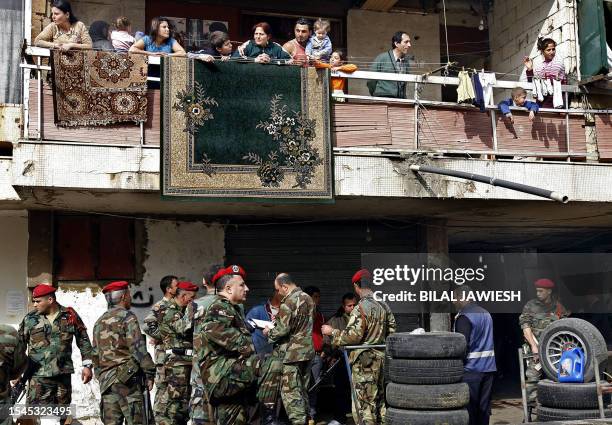 Lebanese army soldiers secure the site where explosives were found hidden inside a tire at a car repair shop in an area close to the southern suburbs...