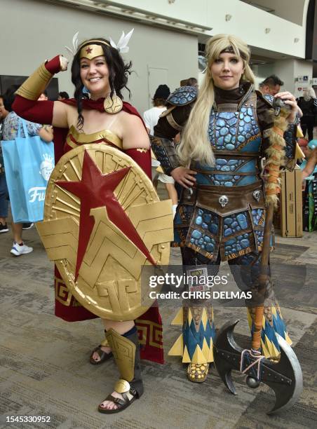 Cosplayers Kelsey Hinesley and Janelle Hinesley pose in the convention center during San Diego Comic-Con International in San Diego, California, on...