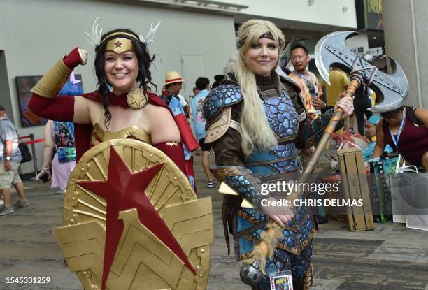 Cosplayers Kelsey Hinesley and Janelle Hinesley pose in the convention center during San Diego Comic-Con International in San Diego, California, on...