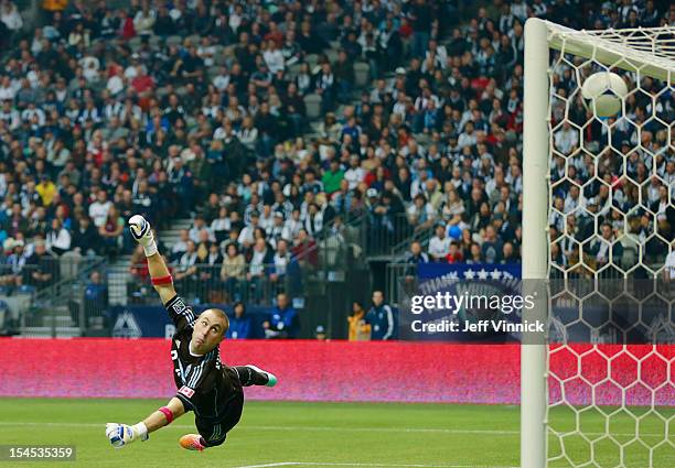 Brad Knighton of the Vancouver Whitecaps FC looks back as the ball enters the goal for the Portland Timbers during their MLS game October 21, 2012 at...