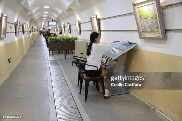Citizens cool off in a bomb shelter in Xi 'an, Shaanxi province, China, July 20, 2023. In recent days, the weather in Xi 'an is stuffy, many citizens...