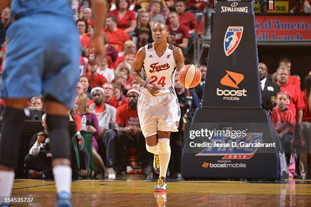 Tamika Catchings of the Indiana Fever brings the ball up court against the Minnesota Lynx during Game four of the 2012 WNBA Finals on October 21,...