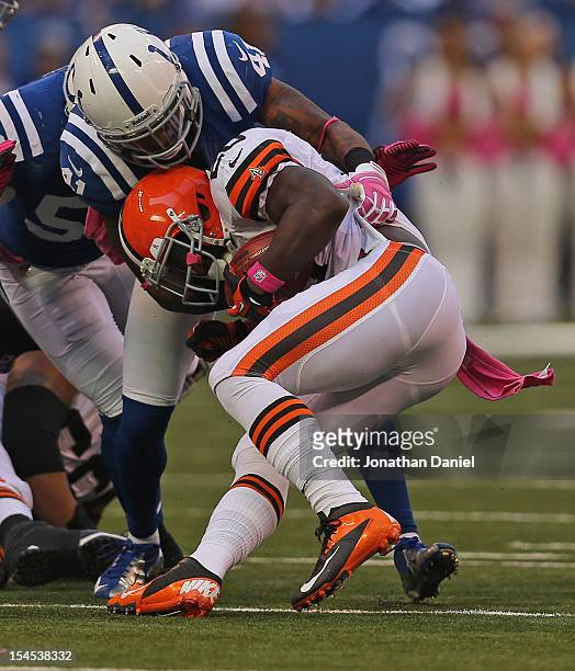Antoine Bethea of the Indianapolis Colts tackles Montario Hardesty of the Cleveland Browns at Lucas Oil Stadium on October 21, 2012 in Indianapolis,...