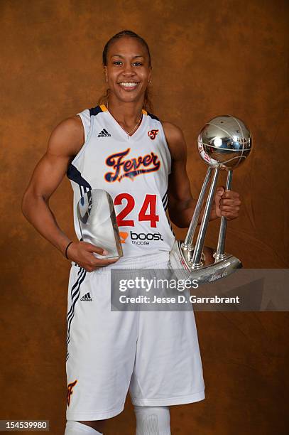 Tamika Catchings of the Indiana Fever poses for portraits with the Championship Trophy and MVP Award after Game four of the 2012 WNBA Finals on...