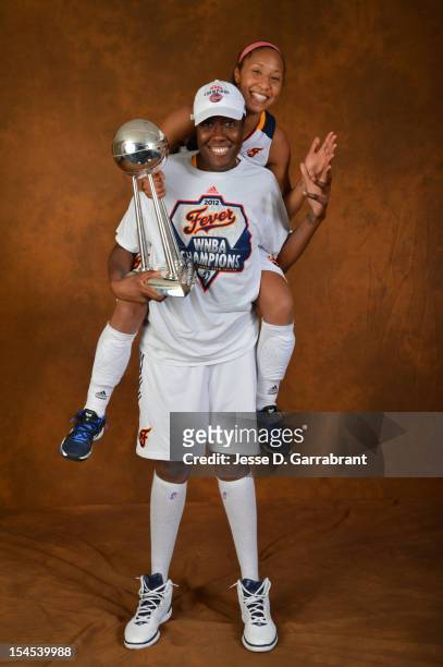 Briann January and Jessica Davenport of the Indiana Fever poses for portraits with the Championship Trophy after Game four of the 2012 WNBA Finals on...