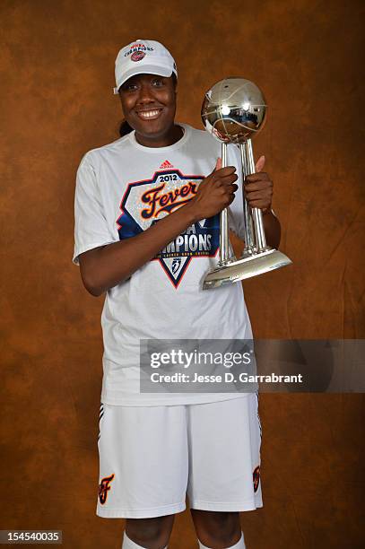 Jessica Davenport of the Indiana Fever poses for portraits with the Championship Trophy after Game four of the 2012 WNBA Finals on October 21, 2012...