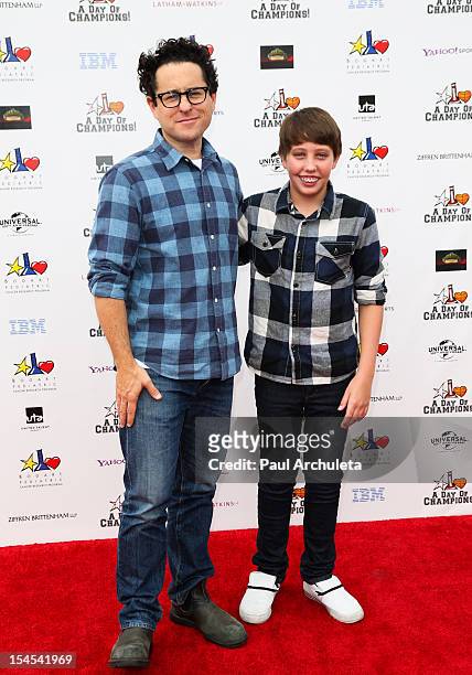 Director JJ Abrams and Actor Ryan Lee attend "A Day Of Champions" benefiting the Bogart Pediatric Cancer Research Program at the Sports Museum of Los...