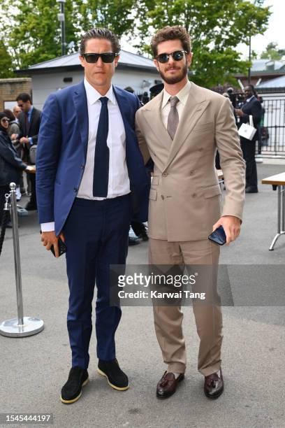 Andrew Garfield and Vito Schnabel attend day thirteen of the Wimbledon Tennis Championships at All England Lawn Tennis and Croquet Club on July 15,...