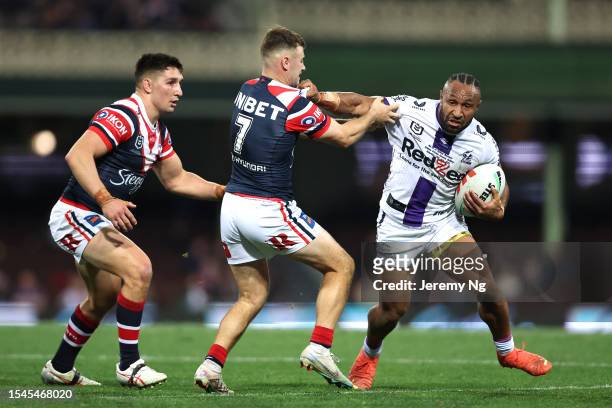 Justin Olam of the Storm runs the ball during the round 20 NRL match between Sydney Roosters and Melbourne Storm at Sydney Cricket Ground on July 15,...
