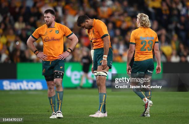 Jed Holloway, Richie Arnold and Carter Gordon of the Wallabies look dejected during The Rugby Championship match between the Australia Wallabies and...