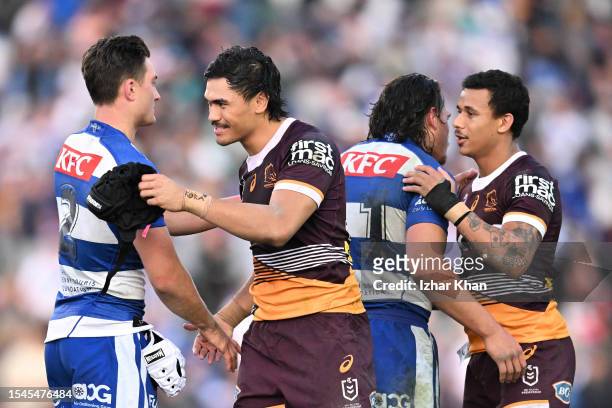 Players from both teams shake hands following the round 20 NRL match between Canterbury Bulldogs and Brisbane Broncos at Belmore Sports Ground on...