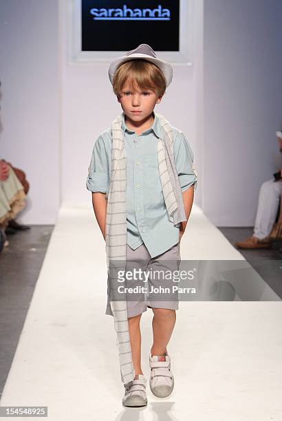 Model walks the runway at the Sarabanda show during Petite Parade NY Kids Fashion Week In Collaboration With VOGUEbambini - Day 2 at Industria...