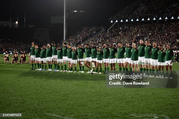 South Africa stand for the national anthems during The Rugby Championship match between the New Zealand All Blacks and South Africa Springboks at Mt...