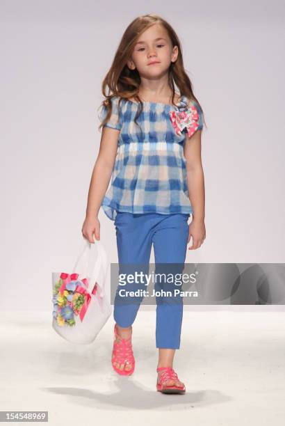 Model walks the runway at the Monnalisa show during Petite Parade NY Kids Fashion Week In Collaboration With VOGUEbambini - Day 2 at Industria...