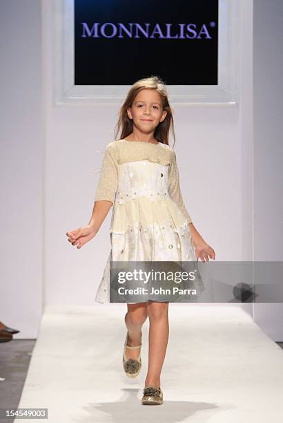 Model walks the runway at the Monnalisa show during Petite Parade NY Kids Fashion Week In Collaboration With VOGUEbambini - Day 2 at Industria...