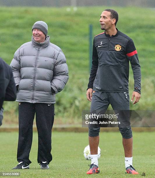 Manager Sir Alex Ferguson and Rio Ferdinand of Manchester United in action during a first team training session, ahead of their UEFA Champions League...