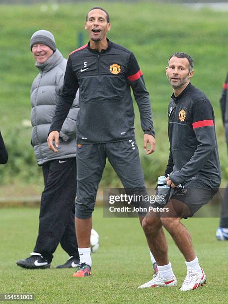 Manager Sir Alex Ferguson and Rio Ferdinand of Manchester United in action during a first team training session, ahead of their UEFA Champions League...