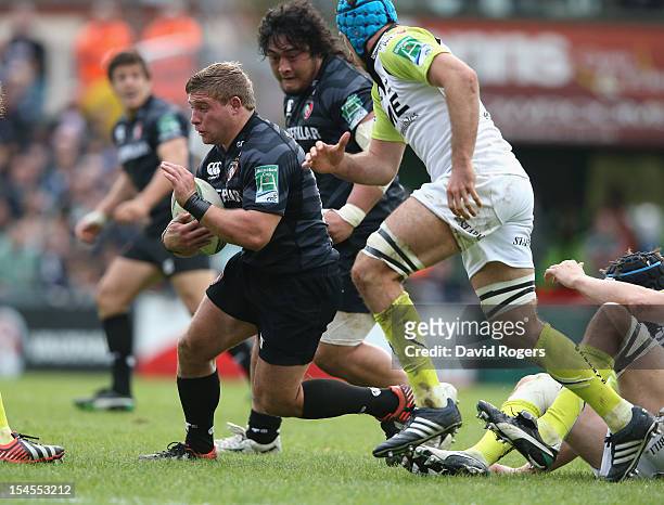 Tom Youngs of Leicester runs with the ball during the Heineken Cup match between Leicester Tigers and Ospreys at Welford Road on October 21, 2012 in...