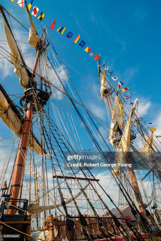 Masts, rigging, signal pennants of tall ship