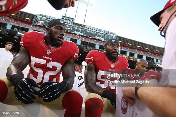 Linebackers Coach Jim Leavitt of the San Francisco 49ers talks with Patrick Willis and NaVorro Bowman during the game against the Seattle Seahawks at...