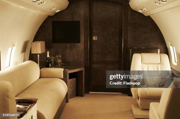 interior of luxury private jet - business class seat stockfoto's en -beelden