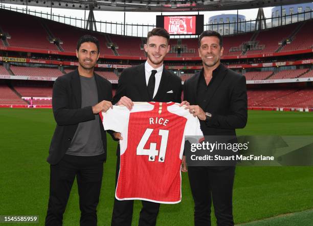 Arsenal manager Mikel Arteta with new signing Declan Rice and Sporting Director Edu at Emirates Stadium on July 15, 2023 in London, England.