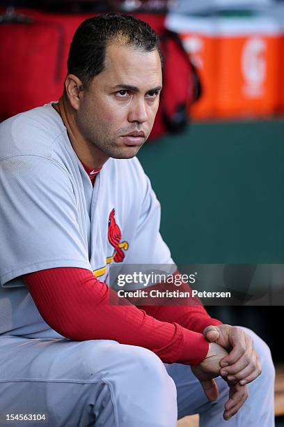 Carlos Beltran of the St. Louis Cardinals sits in the dugout while taking on the San Francisco Giants in Game Six of the National League Championship...