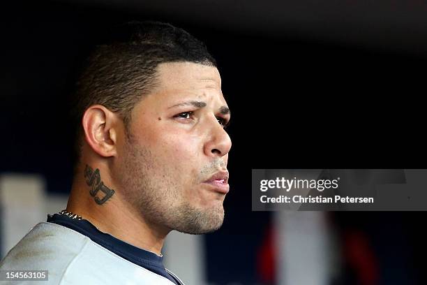 Yadier Molina of the St. Louis Cardinals looks on from in the dugout while taking on the San Francisco Giants in Game Six of the National League...