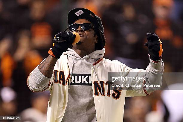 Rapper Lil Wayne sings 'Take Me Out to the Ball Game' during the seventh inning as the San Francisco Giants take on the St. Louis Cardinals in Game...