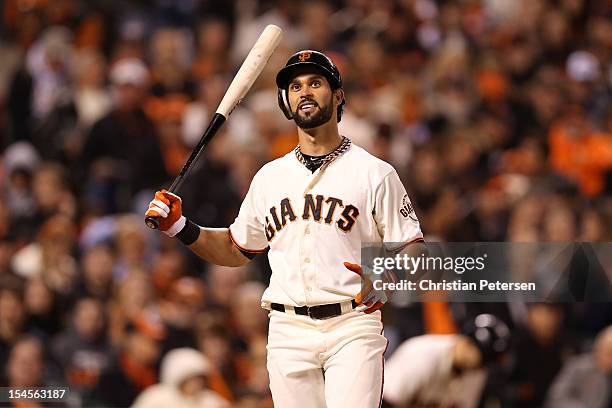 Angel Pagan of the San Francisco Giants reacts while at bat against the St. Louis Cardinals in Game Six of the National League Championship Series at...