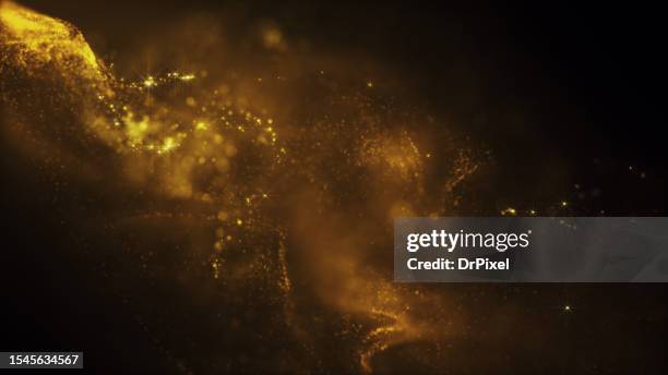 blurry glowing golden particles - nebula gold stock-fotos und bilder