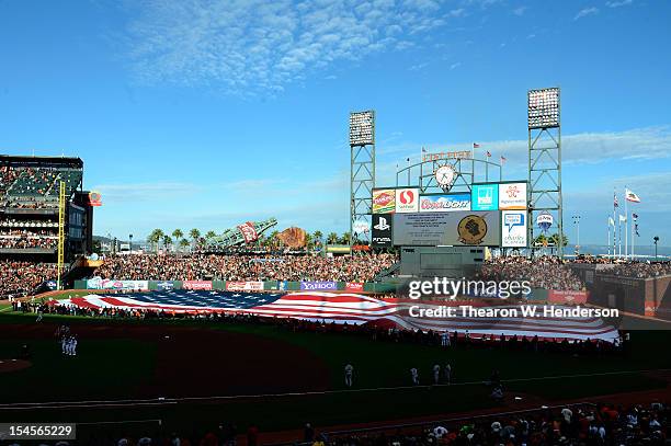 An American flag is displayed across the outfield before the San Francisco Giants take on the St. Louis Cardinals in Game Six of the National League...