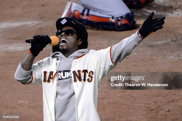 Rapper Lil Wayne sings 'Take Me Out to the Ball Game' during the seventh inning as the San Francisco Giants take on the St. Louis Cardinals in Game...