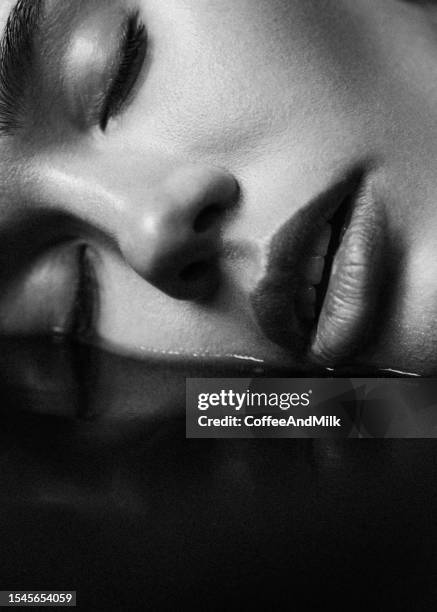 beautiful emotional woman and her reflection. black and white - skin care black and white portrait stock pictures, royalty-free photos & images