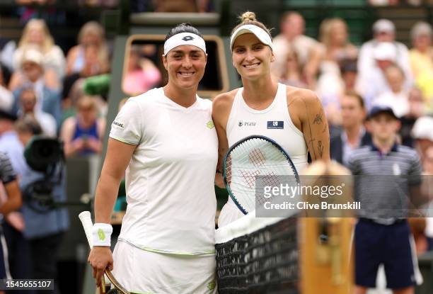 Ons Jabeur of Tunisia and Marketa Vondrousova stand together at the net ahead of the Women's Singles Final on day thirteen of The Championships...