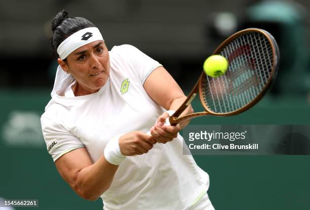 Ons Jabeur of Tunisia plays a backhand during the Women's Singles Final against Marketa Vondrousova of Czech Republic on day thirteen of The...