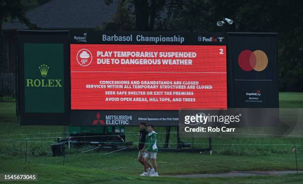Play suspended due to dangerous weather sign is seen on the course as fans exit during the third round of the Barbasol Championship at Keene Trace...