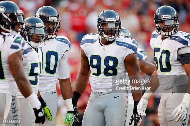 Defensive end Greg Scruggs of the Seattle Seahawks looks to the sidelines for instructions against the San Francisco 49ers on October 18, 2012 at...