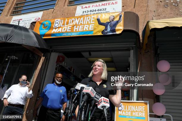 Carolyn Becker, right, Department Director Public Affairs and Communication at the California Lottery, shown with Alva Johnson, second from left,...