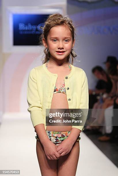 Model walks the runway at the Baby CZ show during the Swarovski Elements at Petite Parade NY Kids Fashion Week In Collaboration With VOGUEbambini -...
