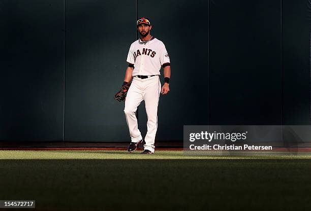 Outfielder Angel Pagan of the San Francisco Giants warms up in the outfield in Game Six of the National League Championship Series against St Louis...