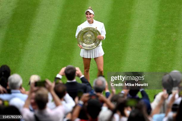 Marketa Vondrousova of Czech Republic with the Women's Singles Trophy as she celebrates victory following the Women's Singles Final against Ons...