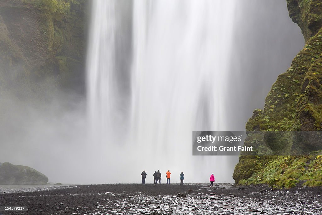 Tourist at waterfall.