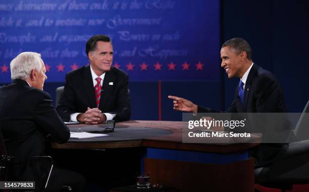 President Barack Obama debates with Republican presidential candidate Mitt Romney as moderator Bob Schieffer of CBS looks on at the Keith C. And...