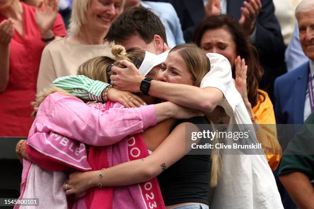 Marketa Vondrousova of Czech Republic celebrates with family following her victory in the Women's Singles Final against Ons Jabeur of Tunisia on day...