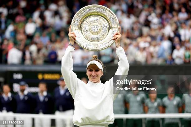 Marketa Vondrousova of Czech Republic lifts the Women's Singles Trophy following her victory in the Women's Singles Final against Ons Jabeur of...