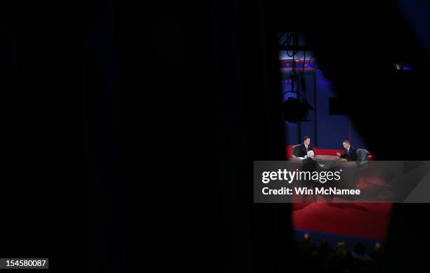 President Barack Obama debates with Republican presidential candidate Mitt Romney as moderator Bob Schieffer of CBS looks on at the Keith C. And...