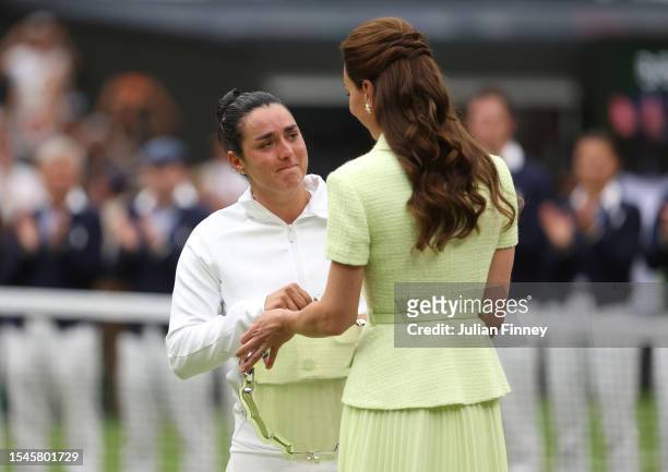 Ons Jabeur of Tunisia is consoled by Catherine, Princess of Wales following defeat in the Women's Singles Final against Marketa Vondrousova of Czech...