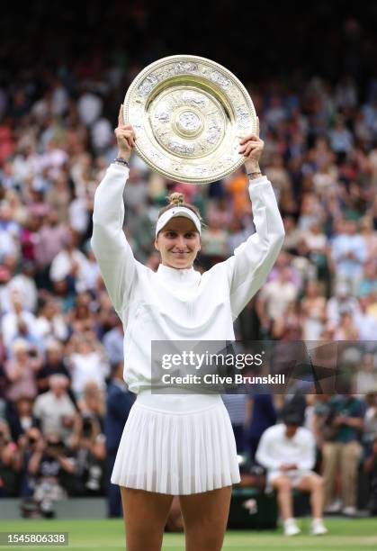 Marketa Vondrousova of Czech Republic lifts the Women's Singles Trophy following her victory in the Women's Singles Final against Ons Jabeur of...