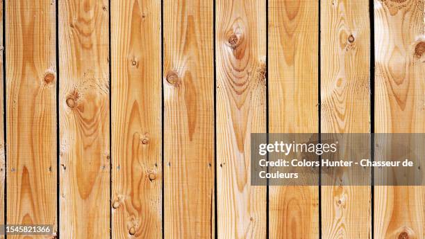 natural and textured wooden plank wall in paris, france - balkengerüst stock-fotos und bilder
